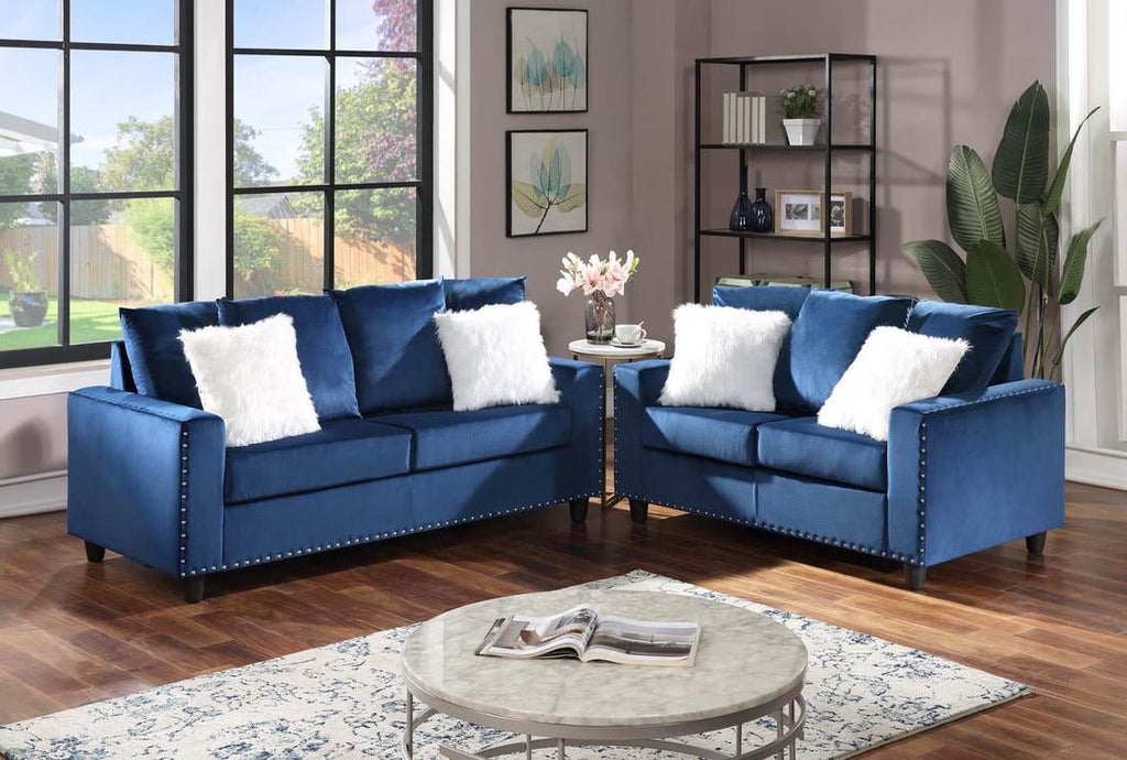 sofa and loveseat in blue velvet fabric